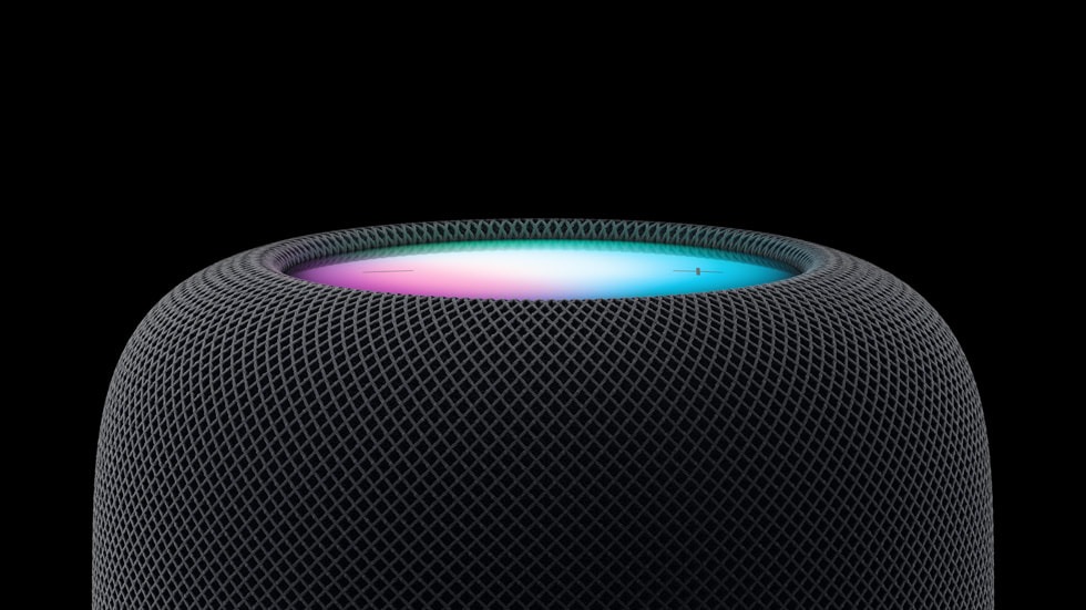 HomePod negro con la pantalla con los colores de Siri